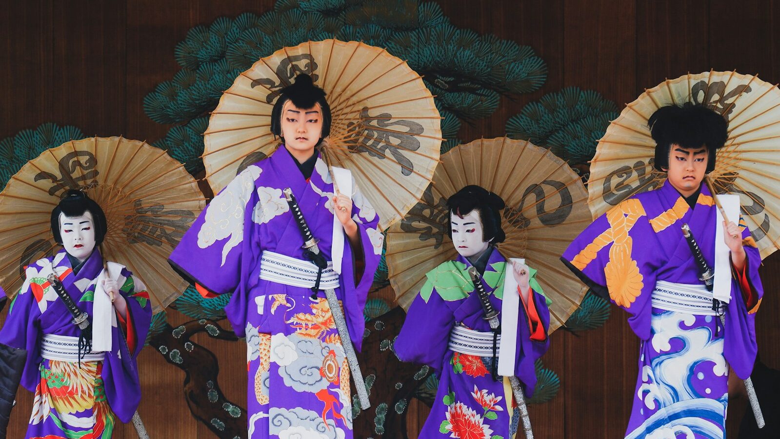 woman in kimono standing on wooden bridge